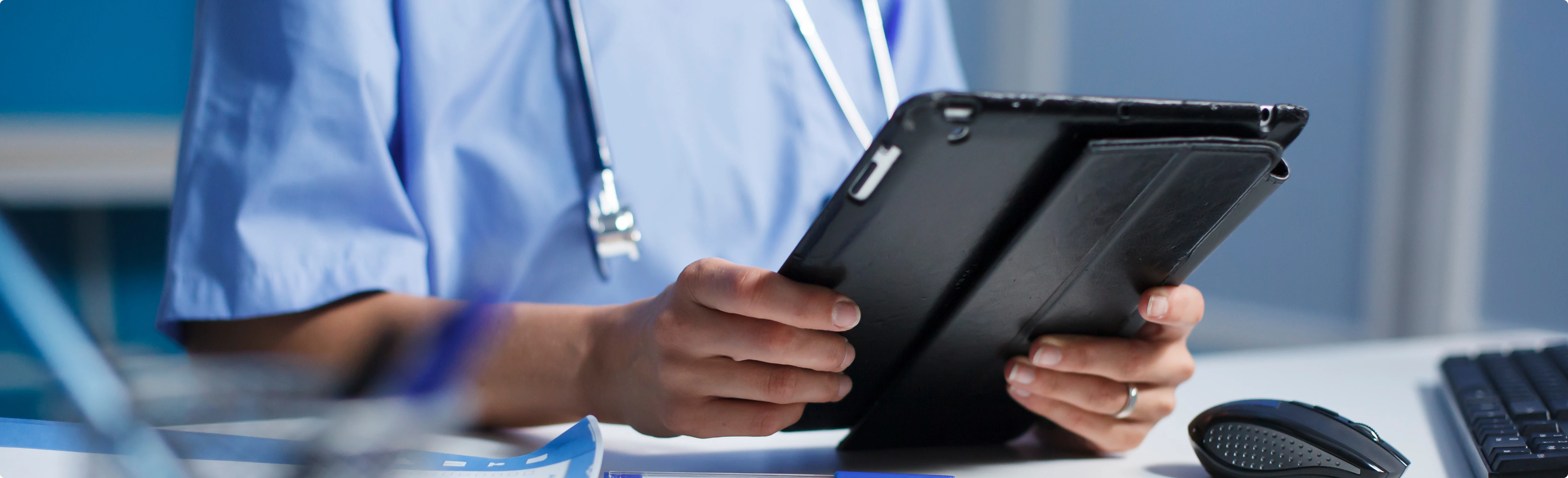 Healthcare professional using diagnostic tablet